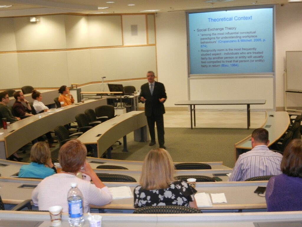 A workplace training session in a tiered lecture room